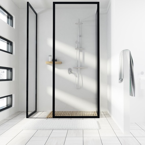 A Shower Door Surround by White Tile.